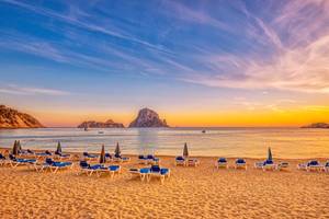 View of a beach at Cala d´Hort, Ibiza, as the sun is setting