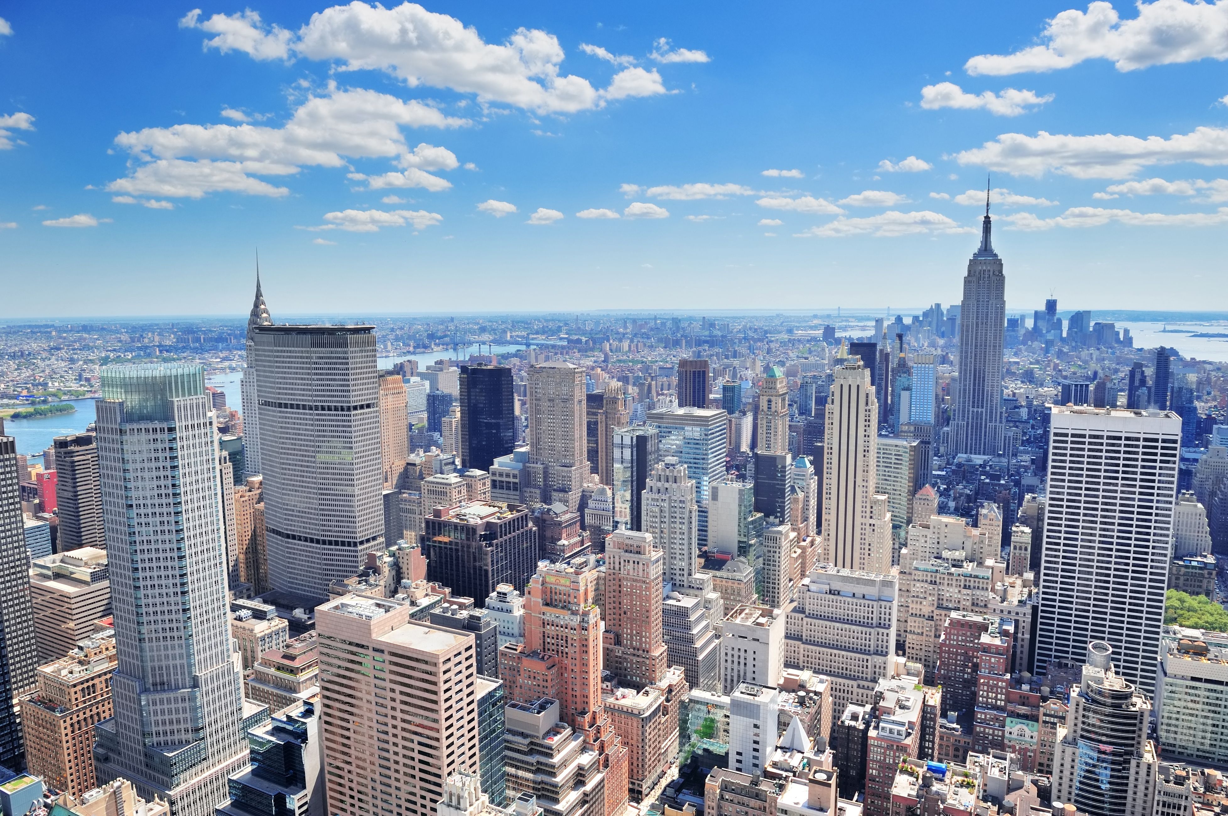 An aerial view of New York City's skyscrapers in Manhattan midtown on a sunny day