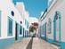 Blue and white houses on a street in Olhao, Algarve