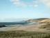 Dusky view of an empty, sandy beach in Scotland