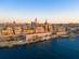 Aerial view of the walled, coastal city of Valletta at sunset