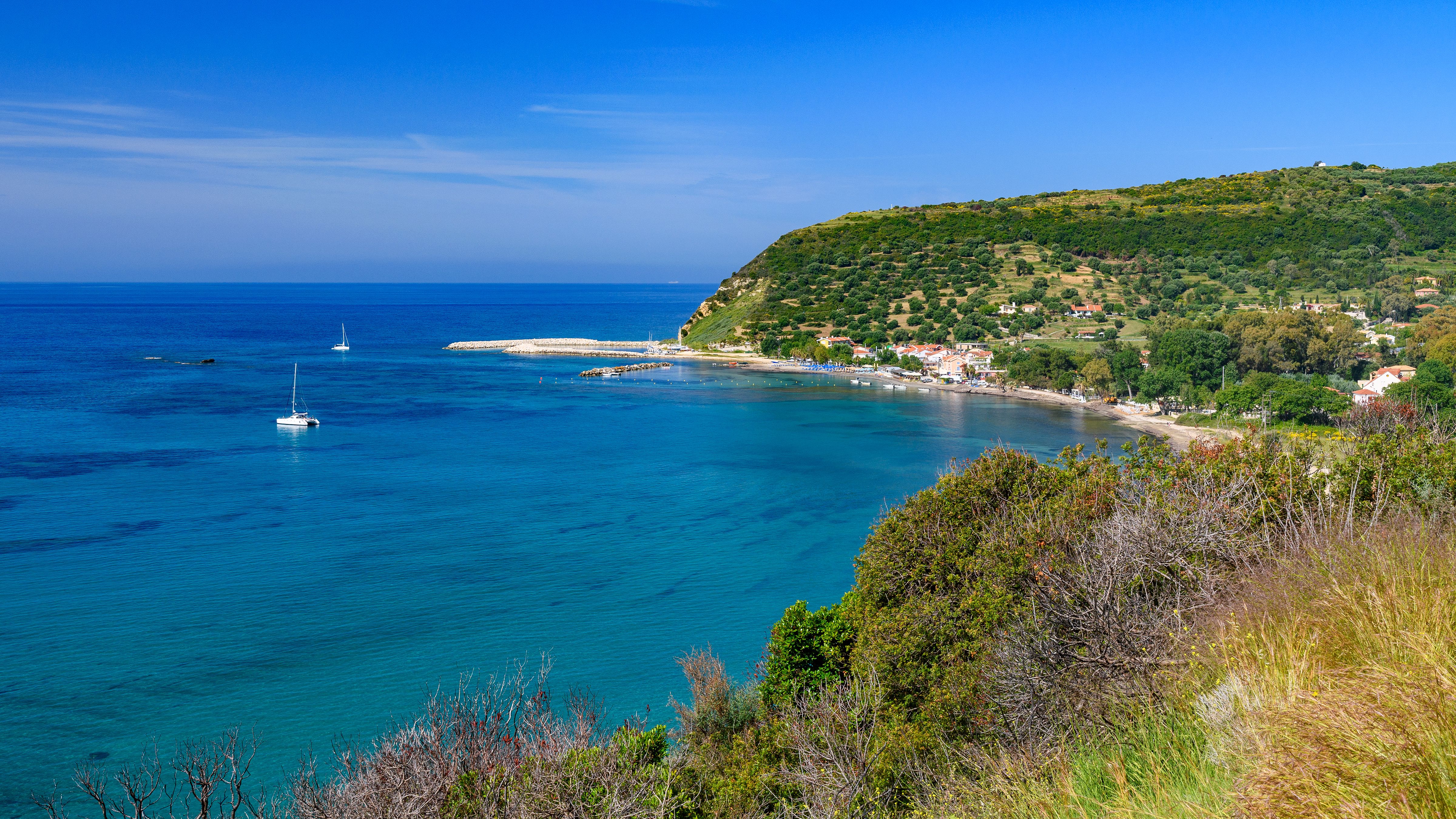 A view across a blue bay of Katelios village in Kefalonia