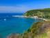 A view across a blue bay of Katelios village in Kefalonia
