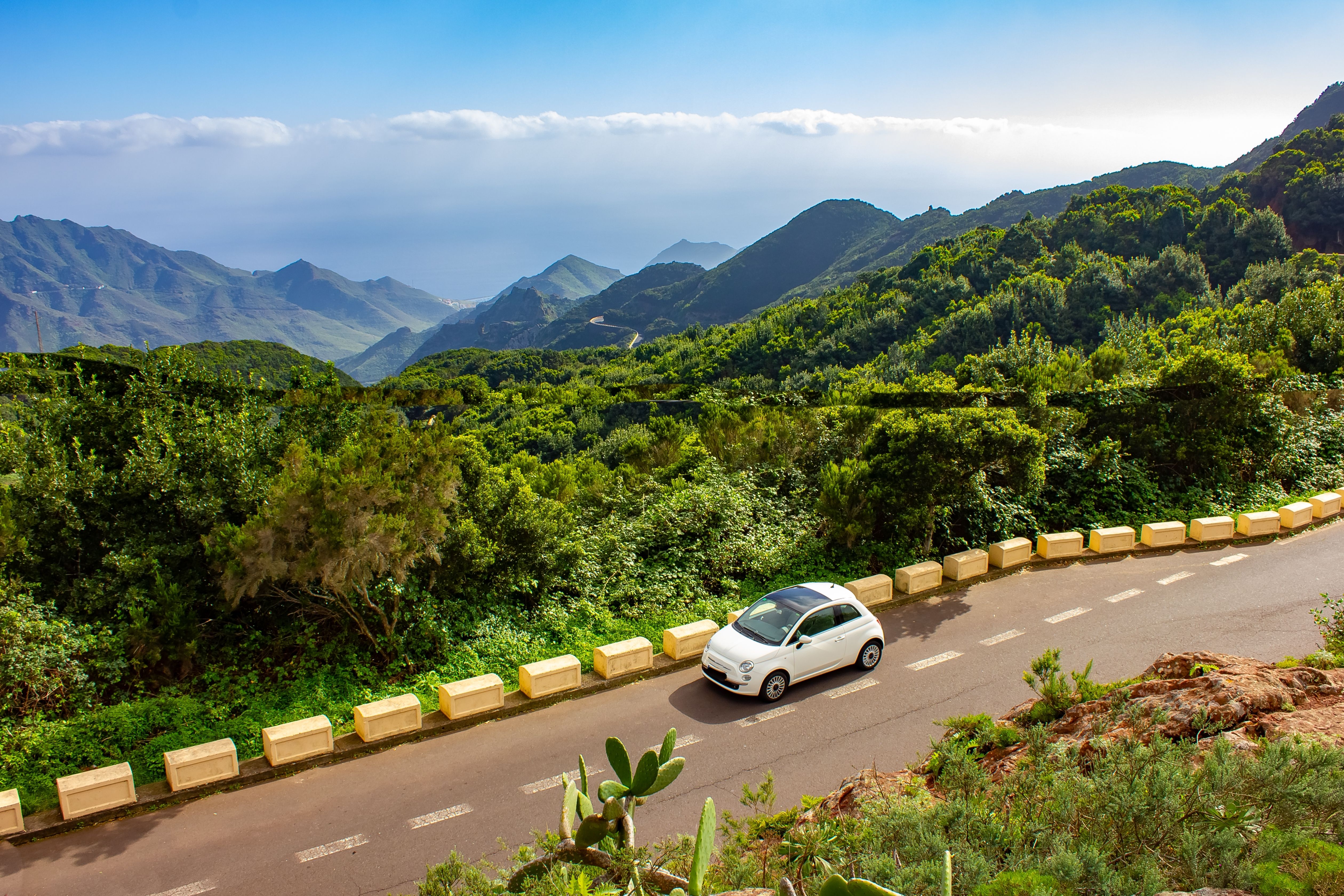 A car driving alongside the Anaga Mountains in Tenerife