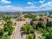 Aerial view of gold-domed Alexander Nevsky Cathedral and surrounding tree-filled plaza in Sofia