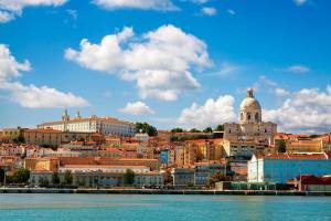 Beautiful view of Lisbon from the Tagus River. The scene is dominated by the Pantheon on the right hand side and the convent of Sao Vicente da Fora at upper left. This is the view that greets visitors arriving by cruise ship.