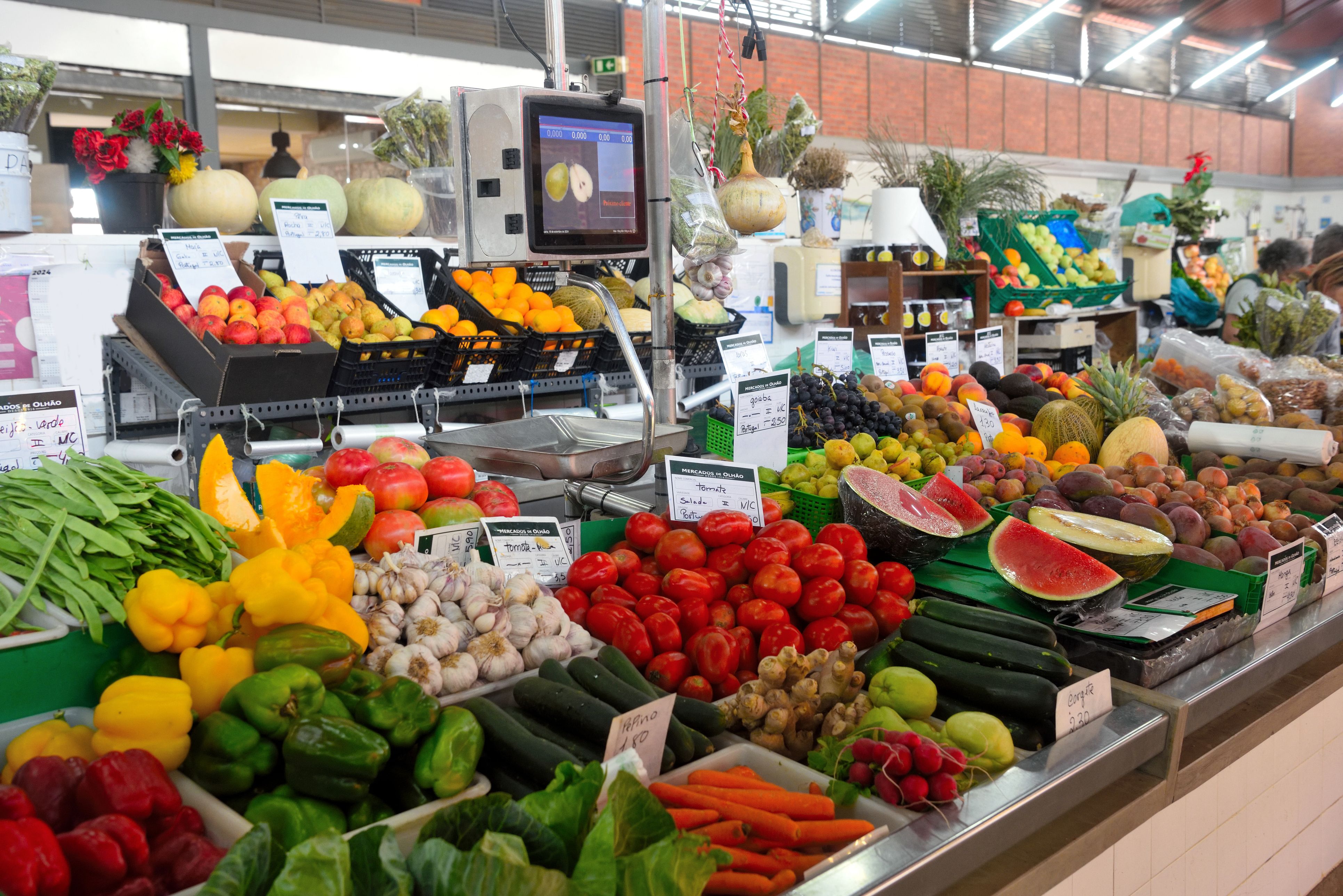 Fresh fruit and vegetables on display at a stall at Olhão market in the Algarve