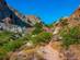 View of a dry rocky path leading through a gorge in Crete, Greece.