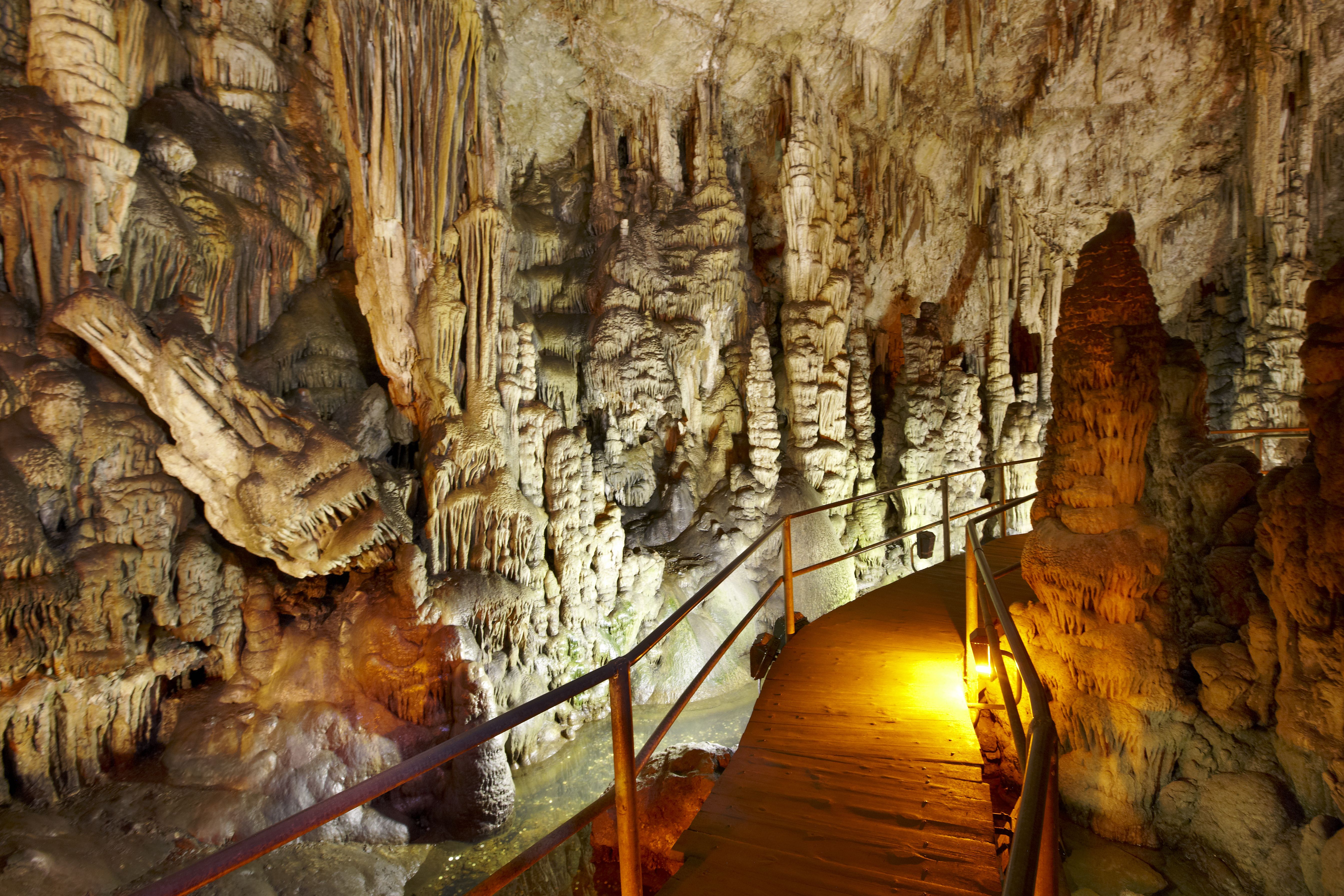 A view of a walkway through rock formations in Dikteon caves, Crete