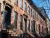 A row of old brownstone homes with staircases in Prospect Heights, Brooklyn, New York
