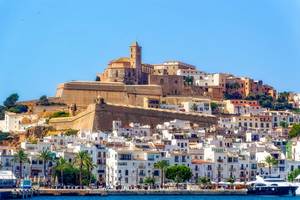 A sea side view to the Ibiza Old Town with Cathedral of Santa Maria d'Eivissa at the top of the hill in Ibiza, Spain.