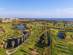 A luxury golf course by the sea with palm trees and lakes in the Algarve, Portugal