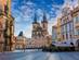 View of Prague's colourful Old Town square with the famous Tyn Church and its spires and the Astronomical Clock
