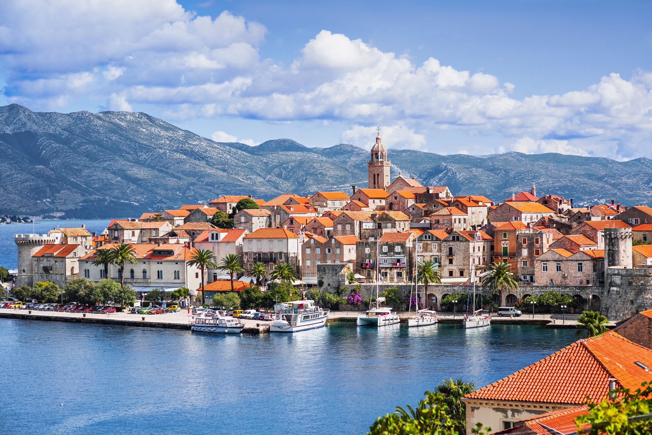 View on the stone buildings of the old town of Korcula, Croatia, surrounded by mountainous islands and the Adriatic Sea