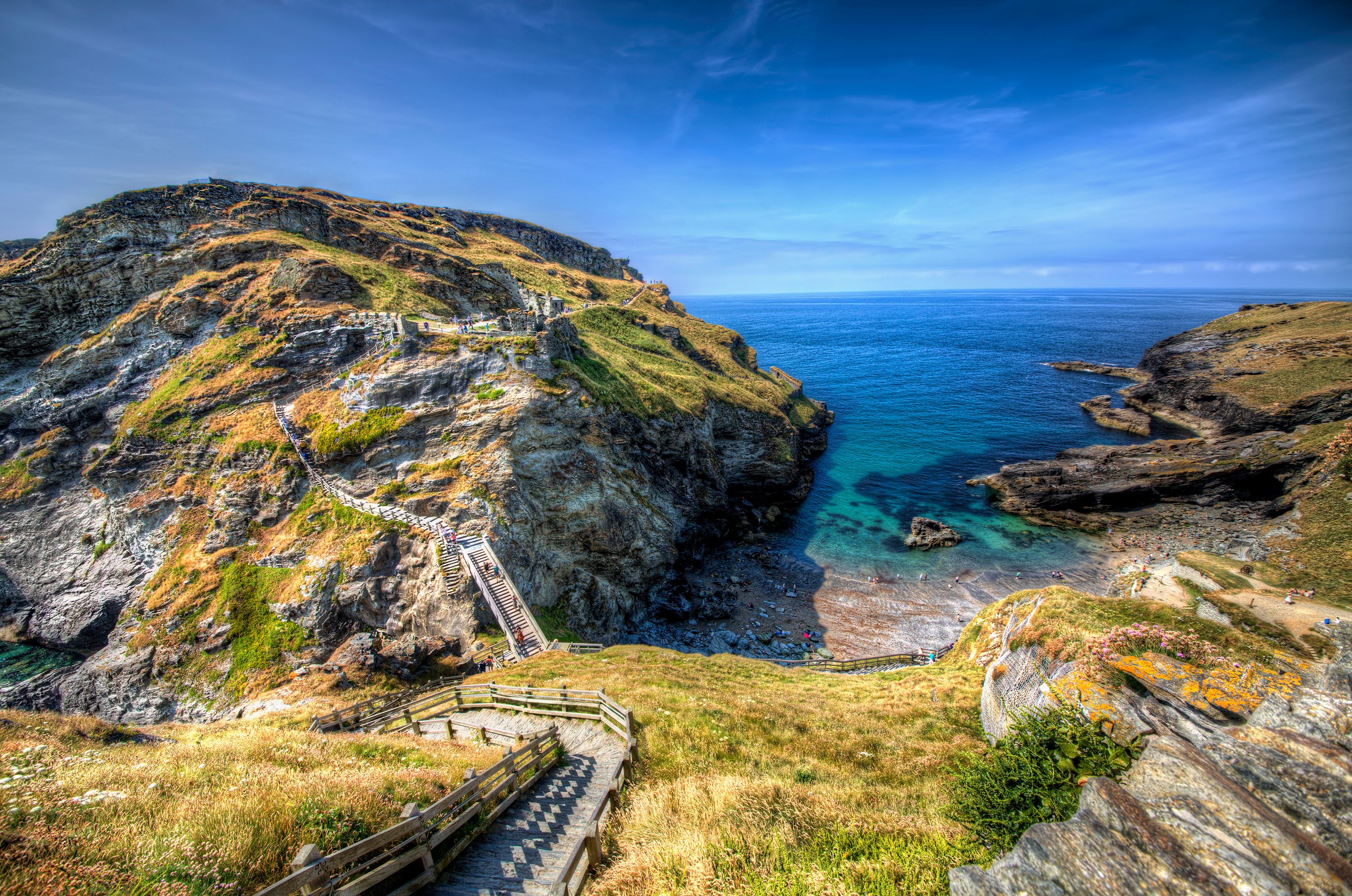 A wooden walkway over coastal cliffs in Tintagel, Cornwall