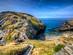 A wooden walkway over coastal cliffs in Tintagel, Cornwall