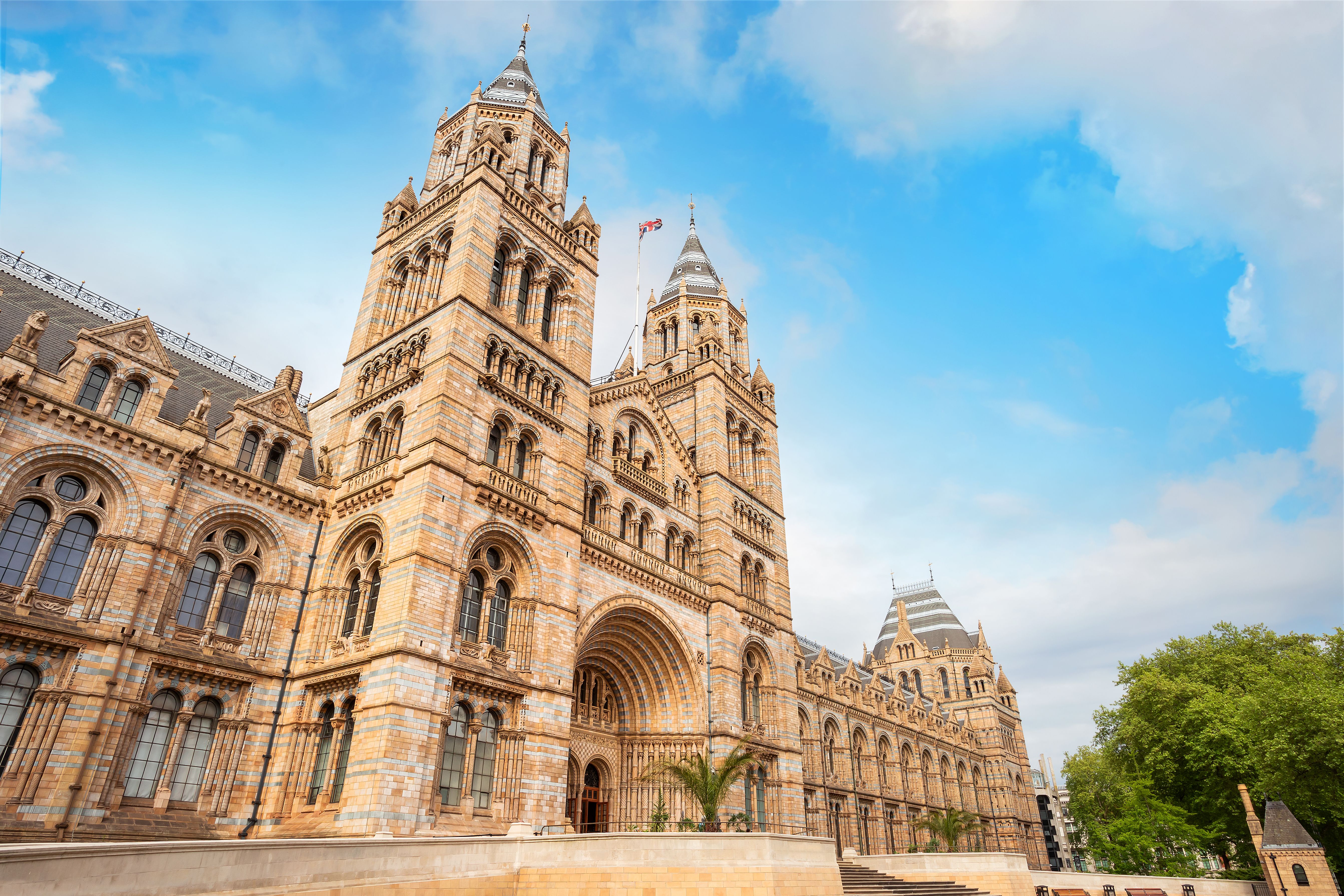Low-angle view of the entry to the terracotta Hintze Hall of the Natural History Museum in London