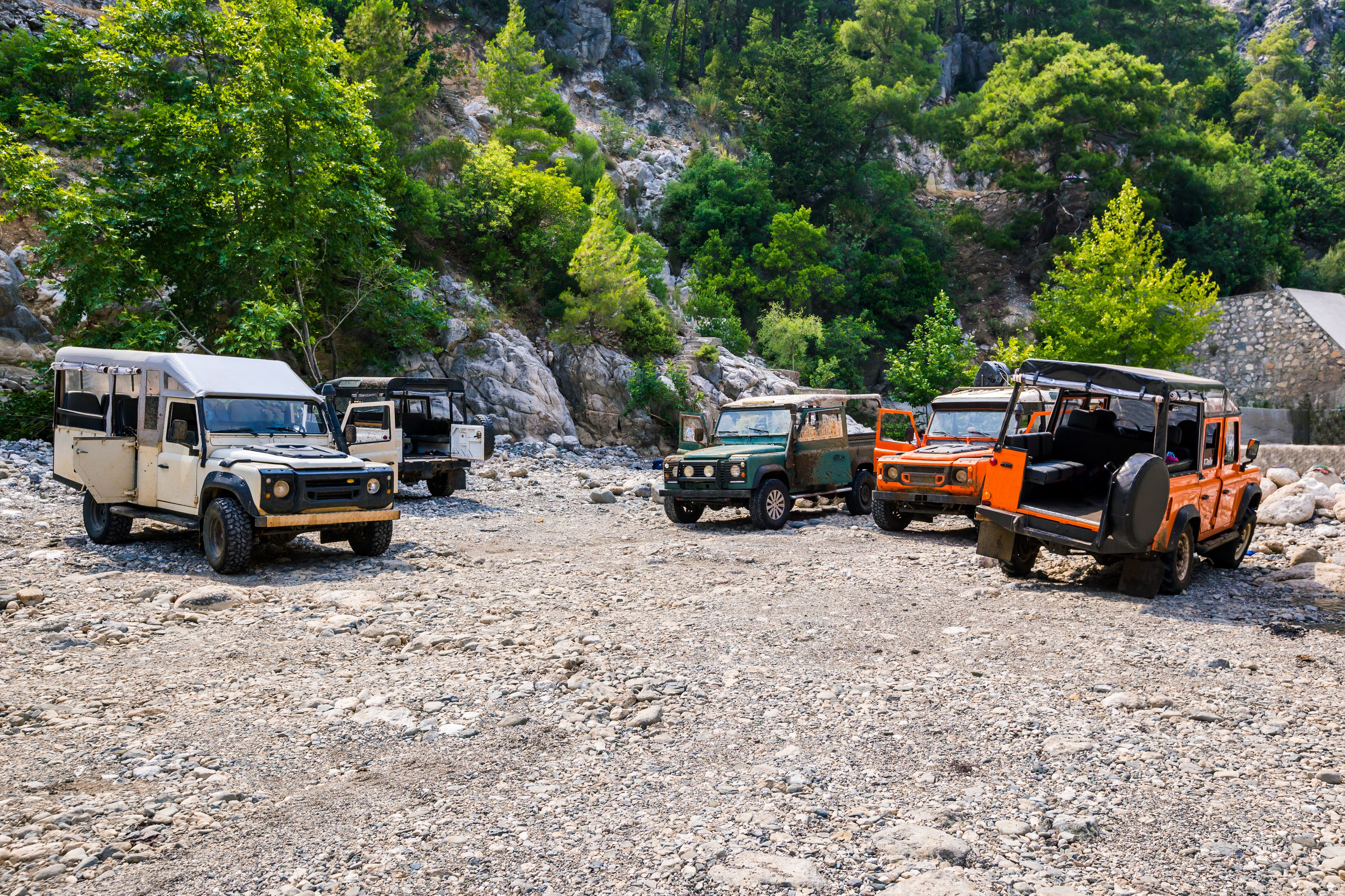 Parked up 4WD vehicles by the mountain in Kemer, Antalya, Turkey