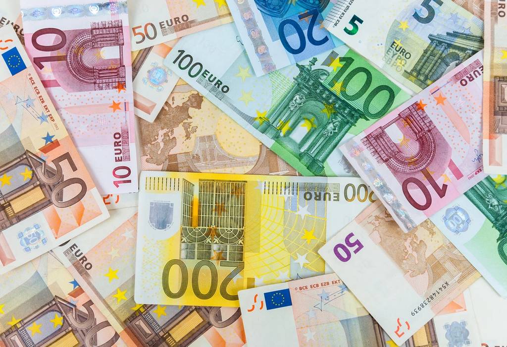 A top view of various euro banknotes