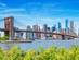 The Brooklyn Bridge and the skyline of New York City as seen from Brooklyn, across the East River