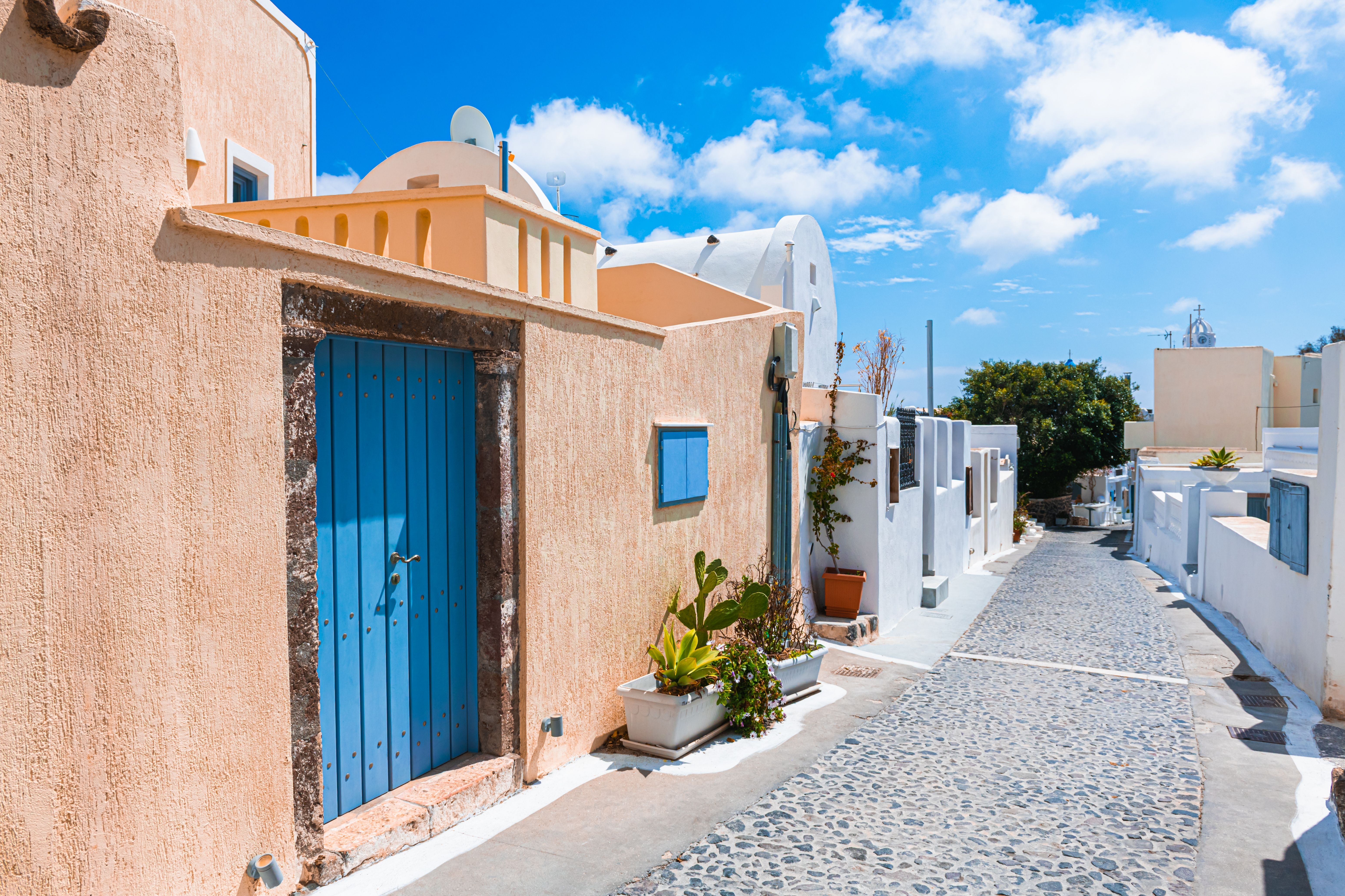 A traditional cobbled street in the village of Megalochori, Santorini