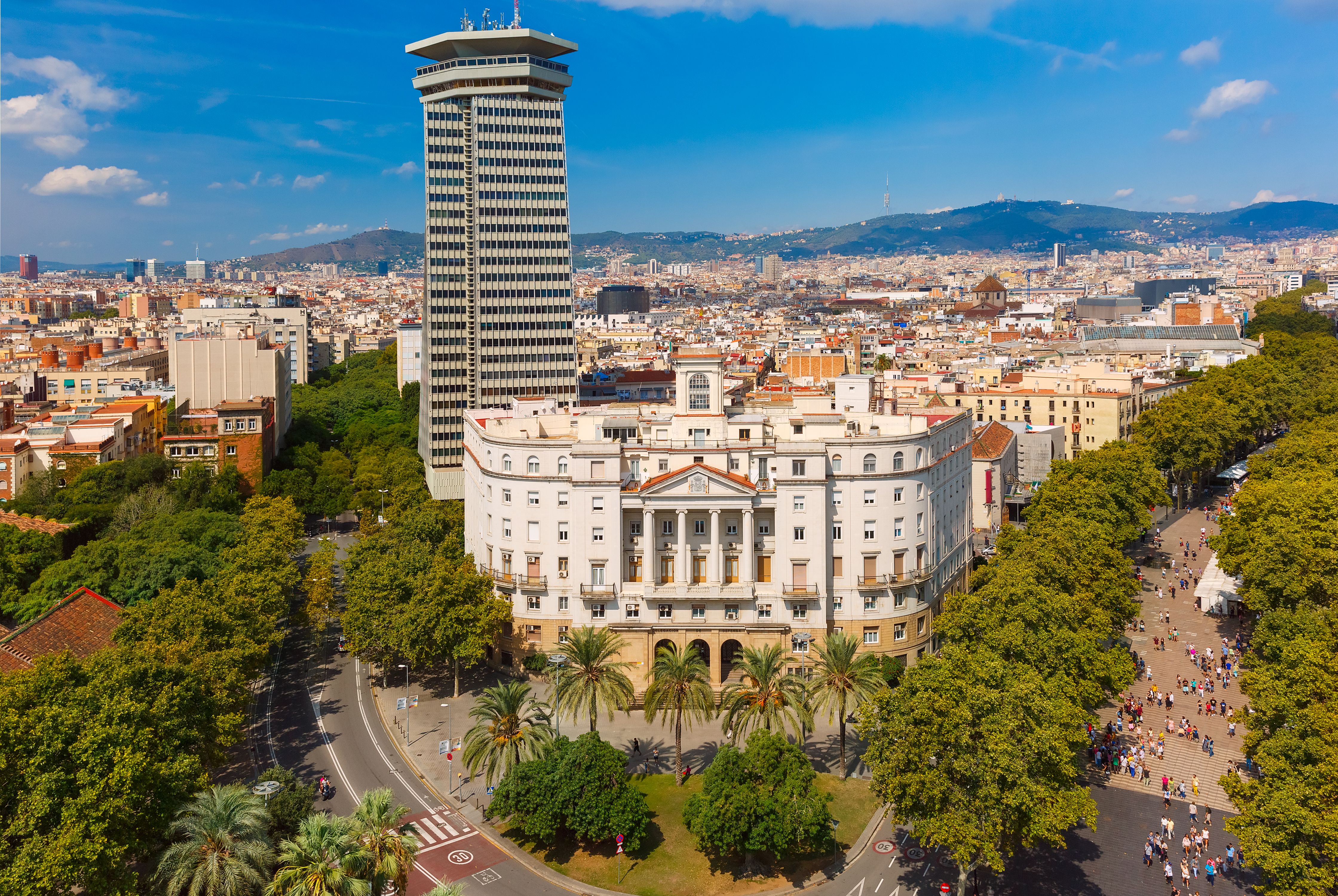 Aerial view over La Rambla in Barcelona a bright blue day