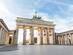 Sunrise illuminated the colonnaded Brandenburger Tor gate with an empty square in front