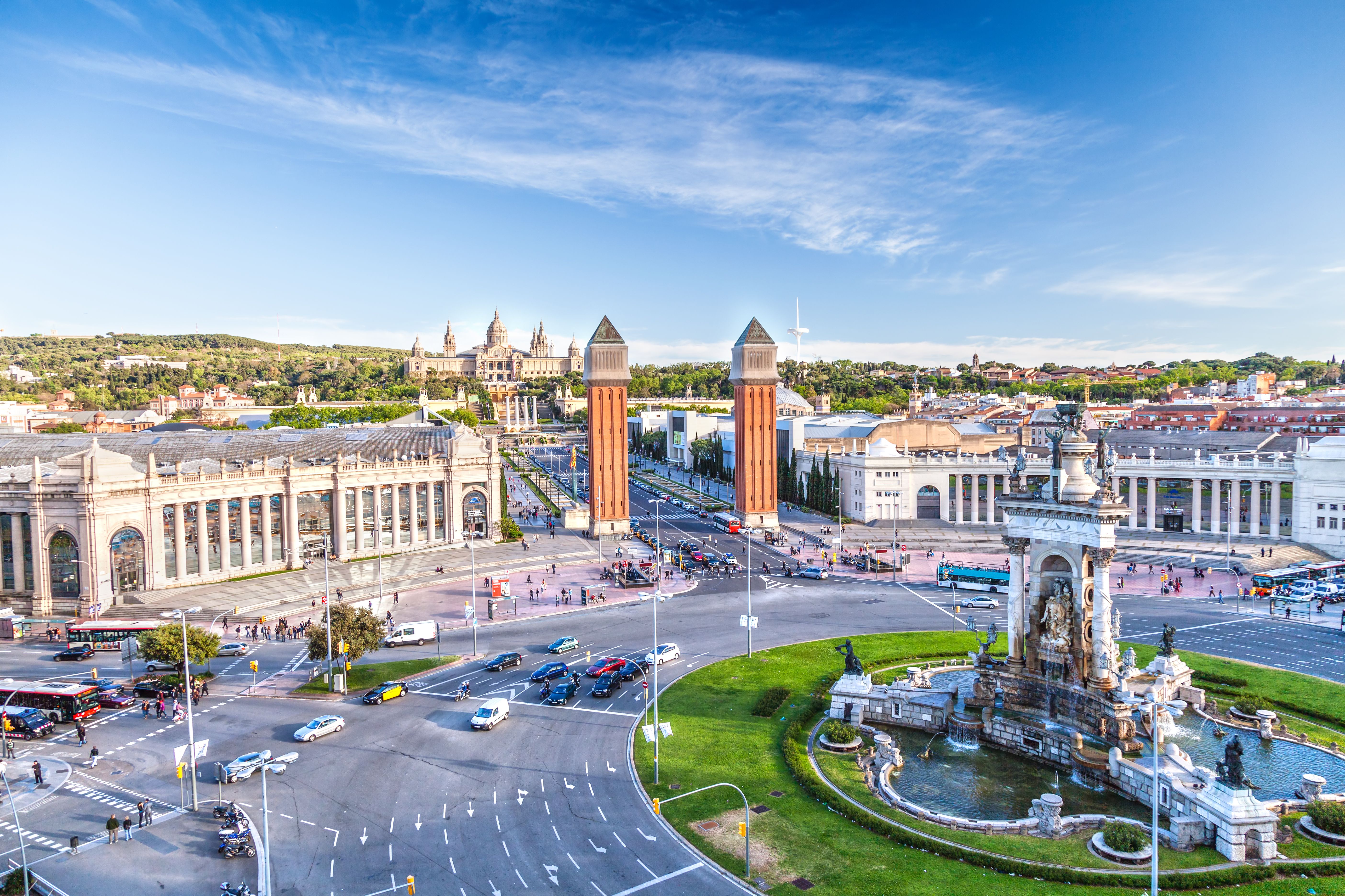 A view of Plaza de Espana in Barcelona, Spain with traffic moving around the central roundabout