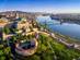 Aerial panoramic skyline view of Buda Castle Royal Palace with Szechenyi Chain Bridge and Hungarian Parliament at sunrise