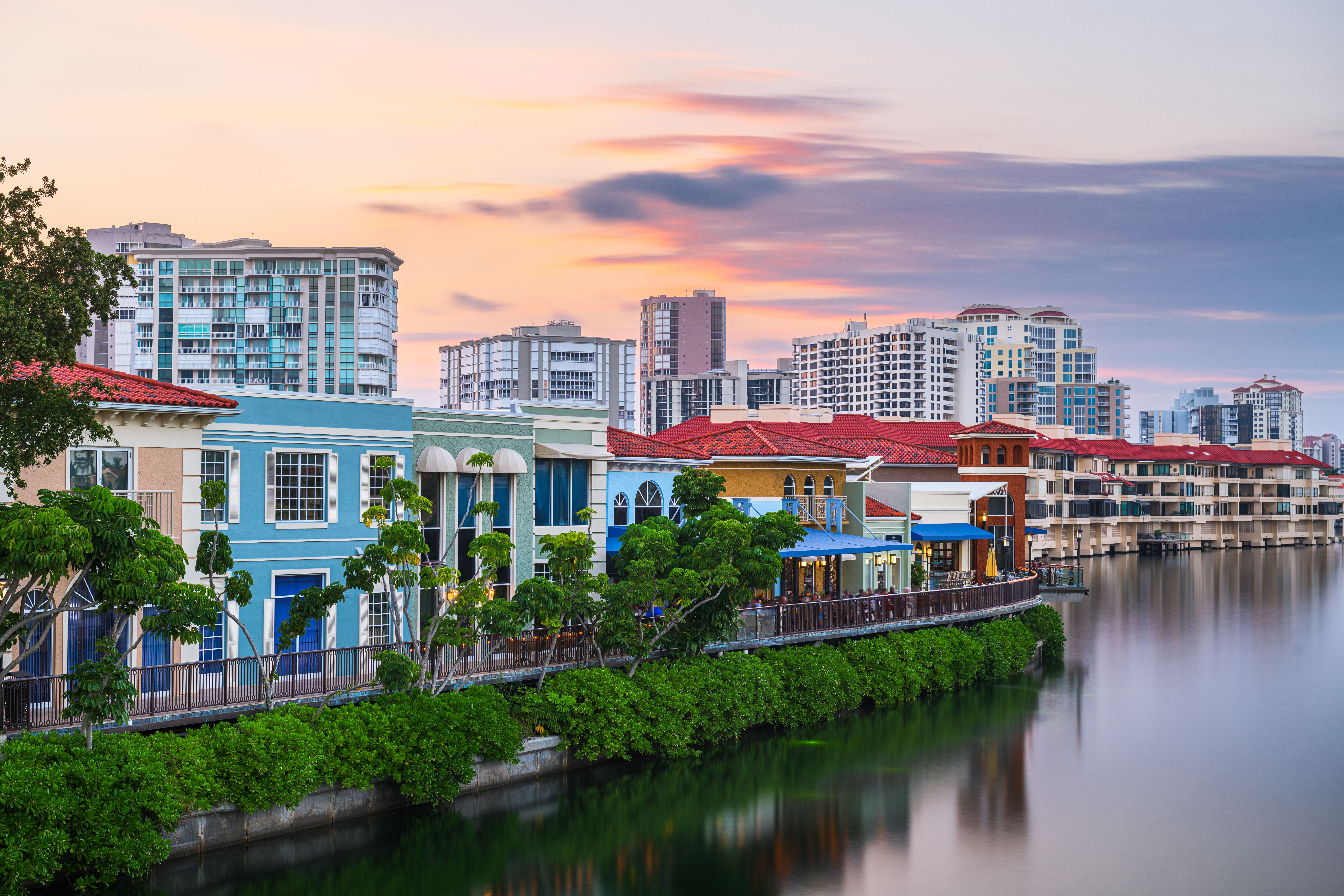 View of colourful waterfront houses and still waters at dusk