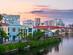 View of colourful waterfront houses and still waters at dusk