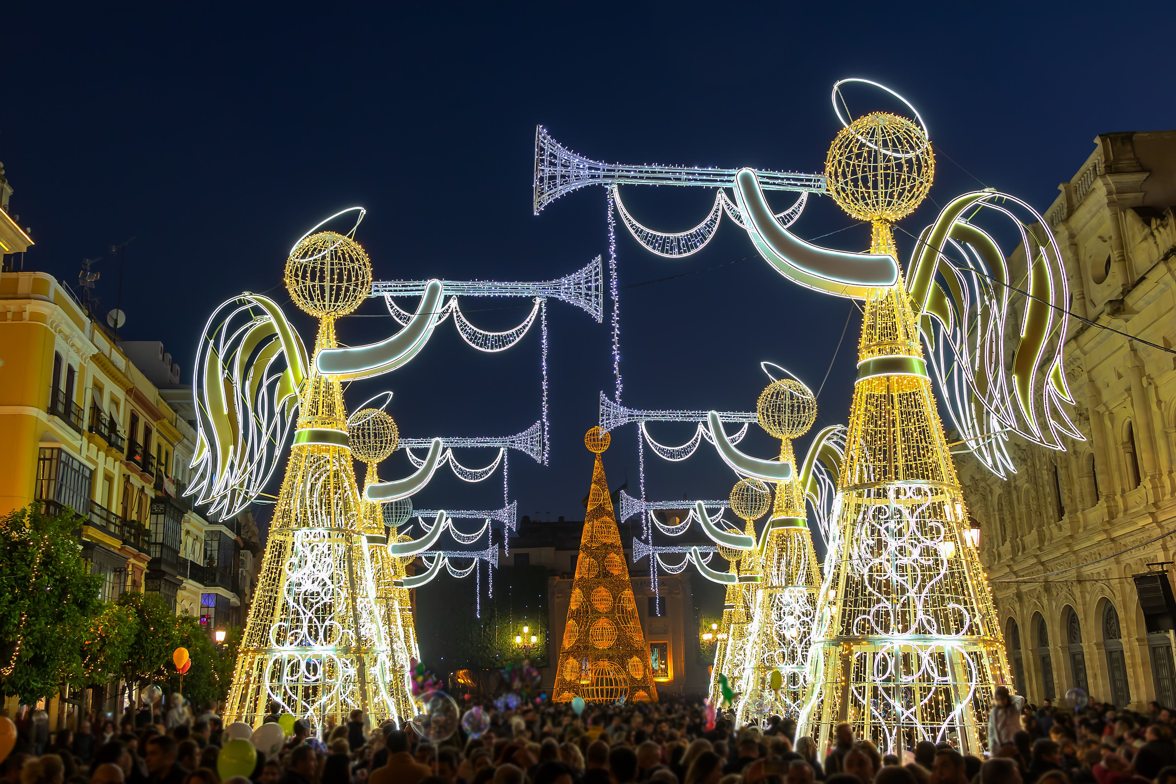Giant angel illuminations and Christmas lights at City Hall in Seville, Spain