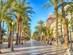 View of the Explanada promenade in Alicante lined by palm trees