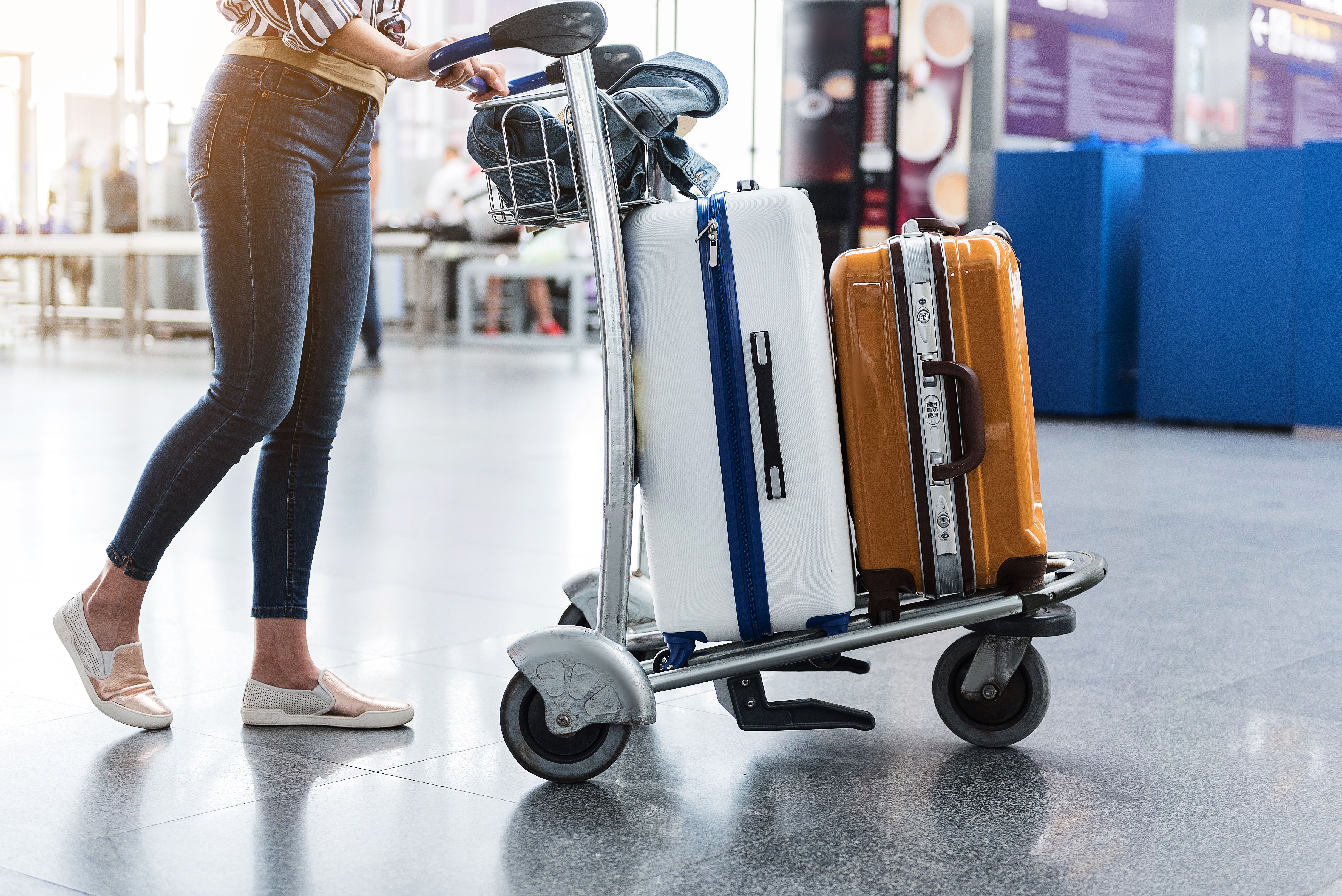 A close up of a luggage trolley loaded with bags at an airport