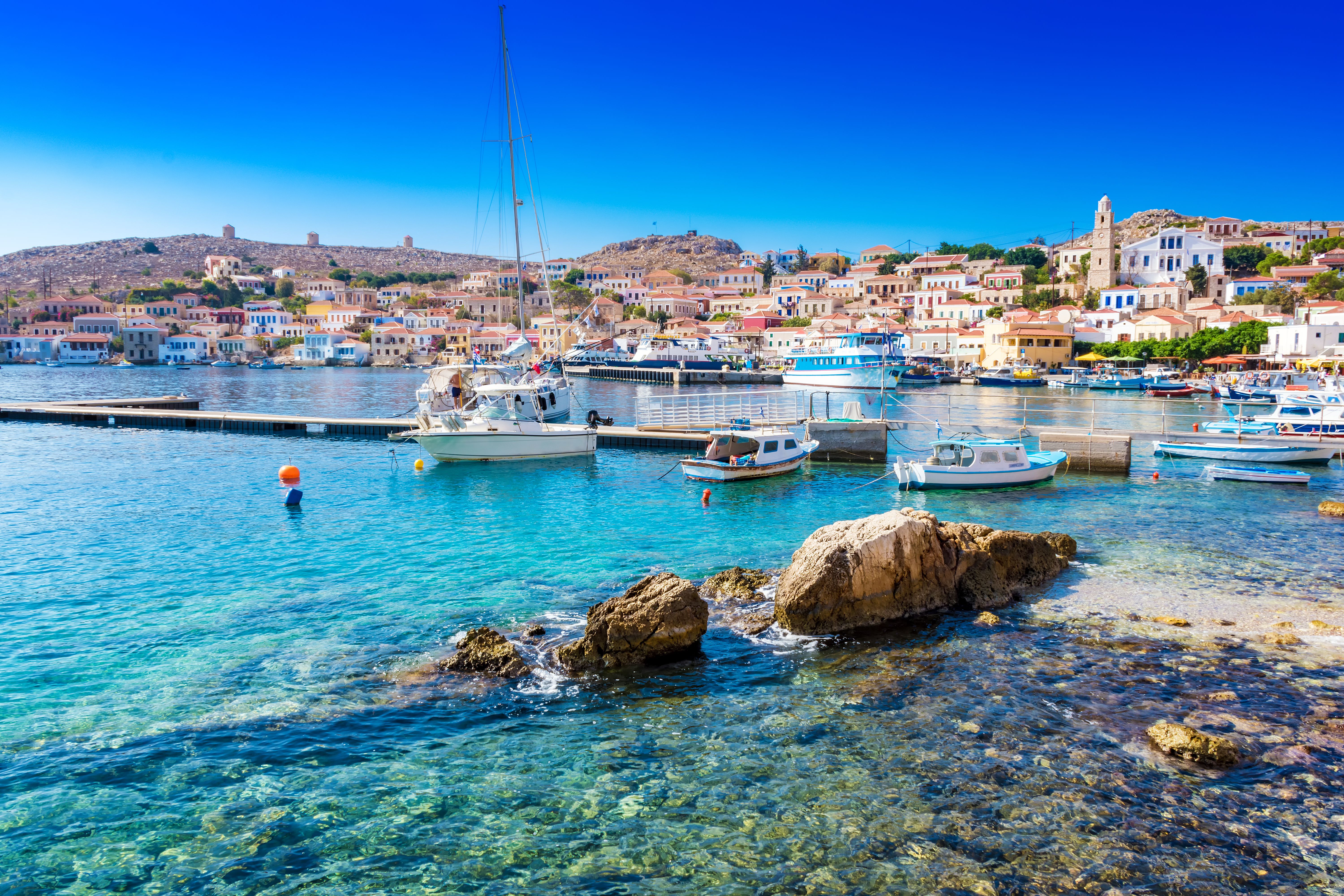 Boats in port of town Emporio on Halki island, Greece