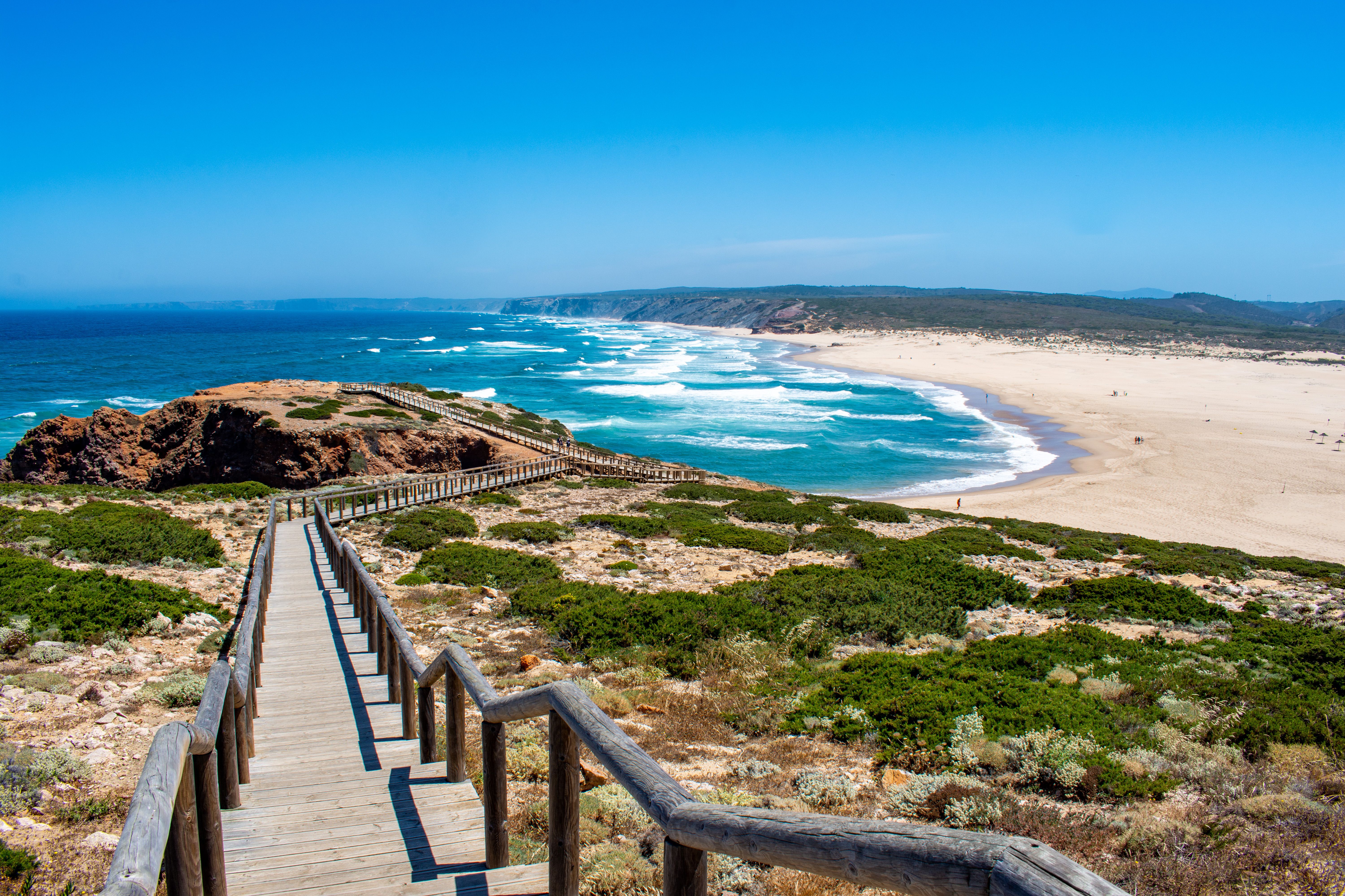 A wooden walk way leading down to Praia da Bordeira in Portugal