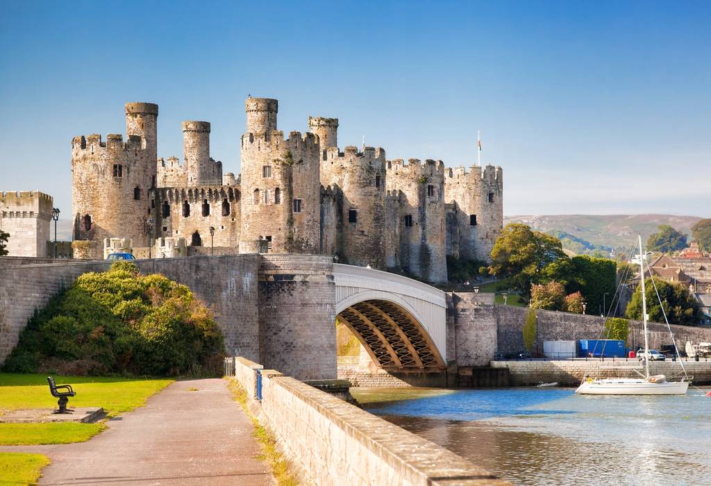 The fairytale-esque Conwy Castle with its limestone and sandstone turrets and a bridge over the River Conwy