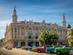 View of colourful vintage cars in front of a grand building in Havana, Cuba