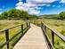 A wooden walkway through Albufera des Grau National Park, Menorca
