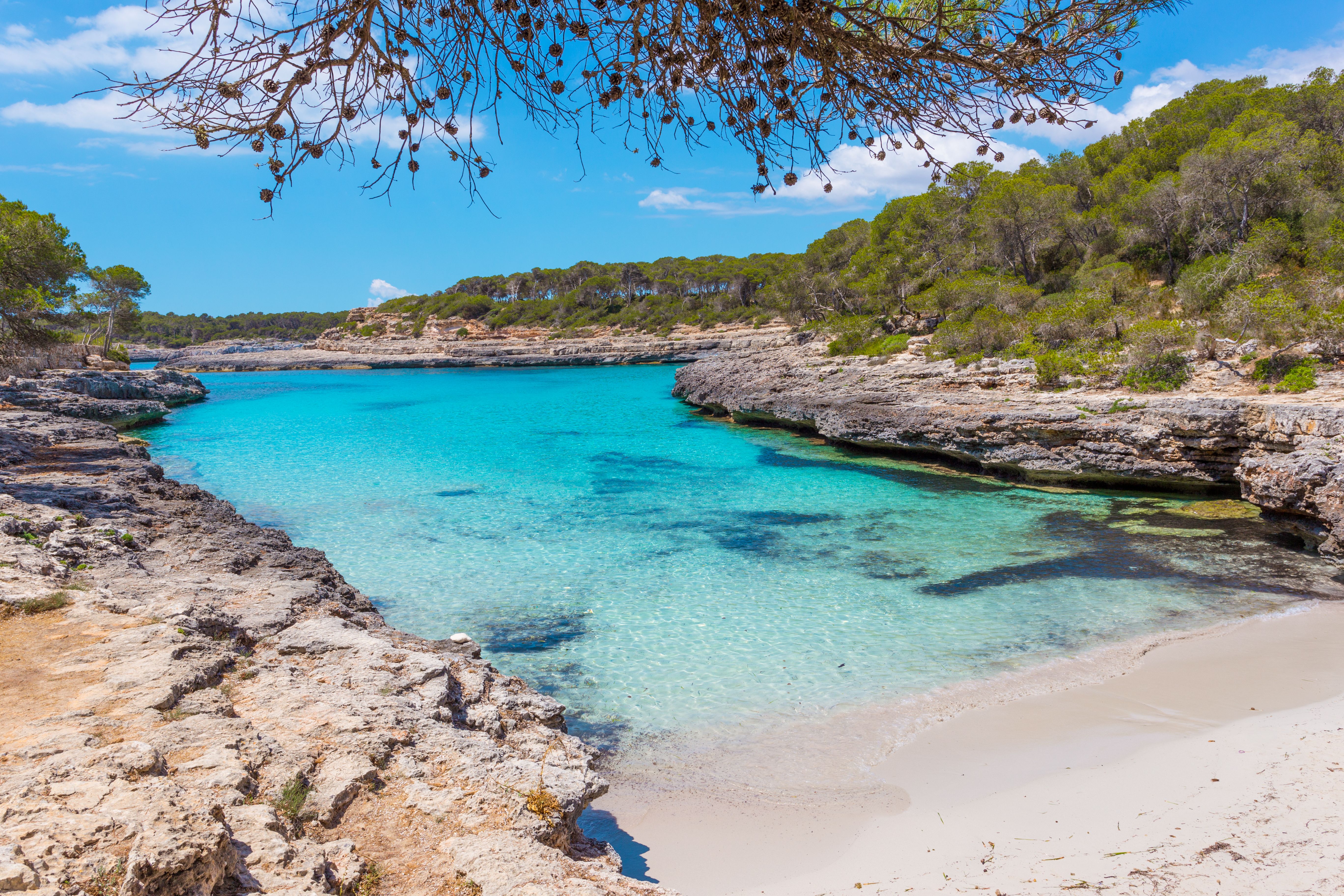 A secluded beach with turquoise water in the Mondrago Natural Park, Majorca