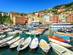 A view of colourful boats and waterfront buildings in Genoa, Italy