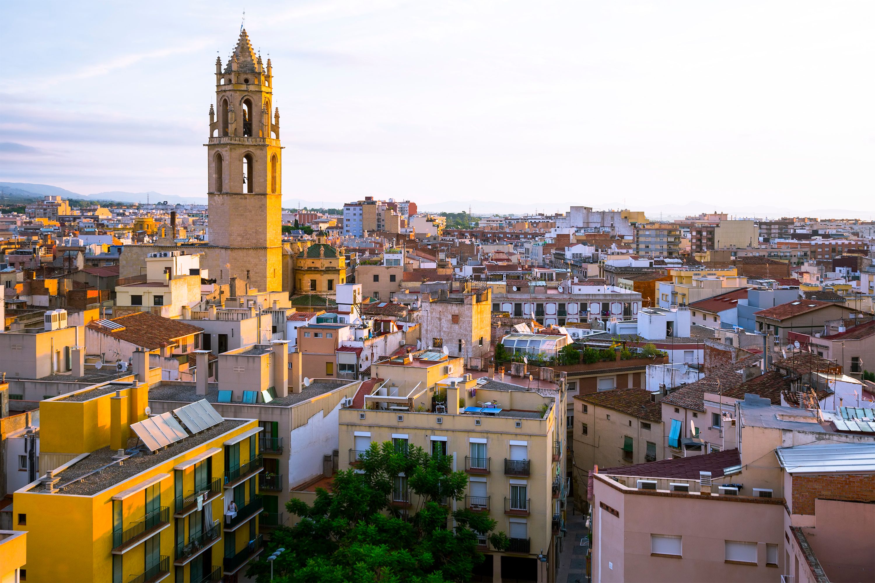 View on the rooftops and houses at sunrise over the city of Reus