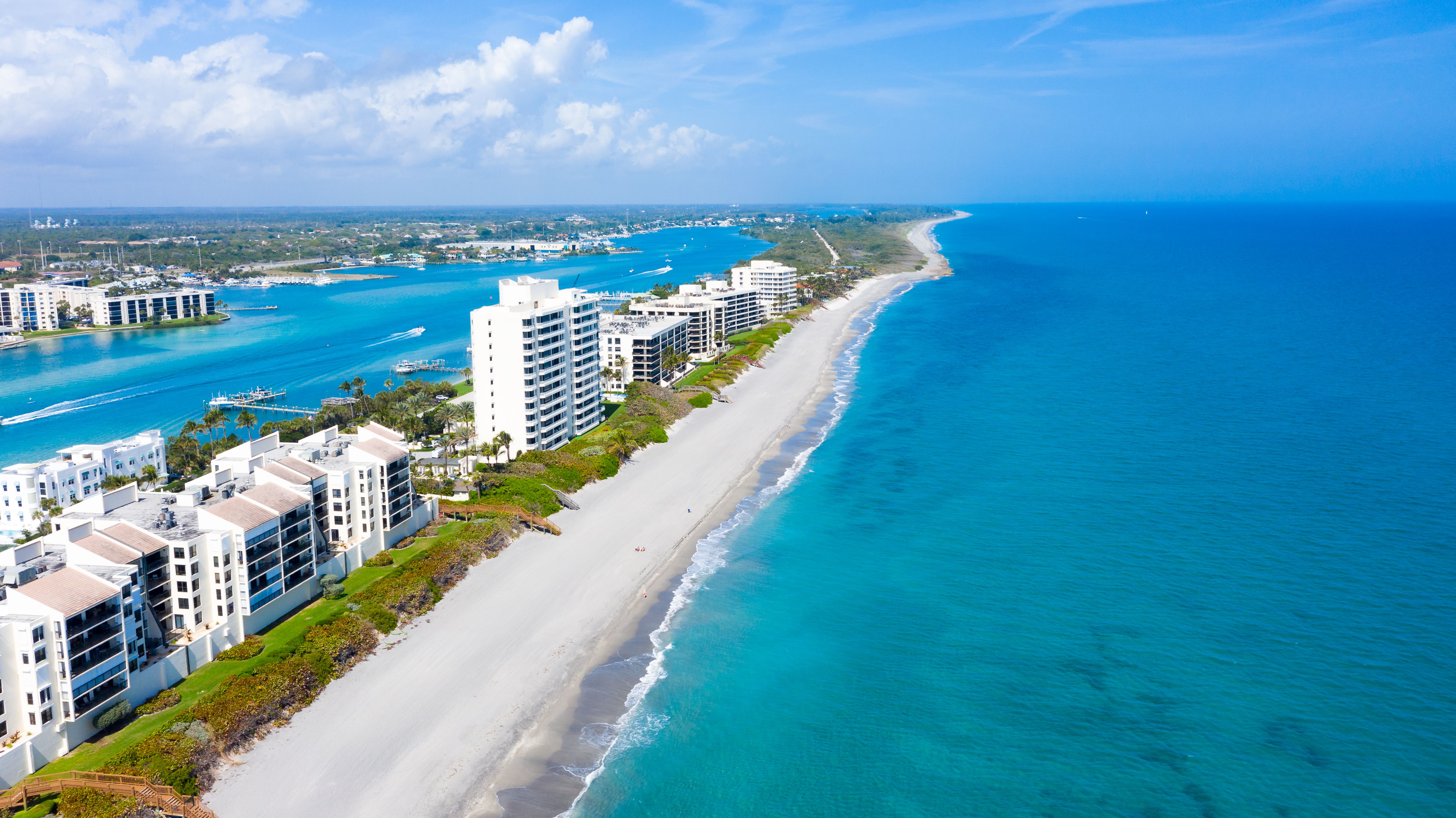 A view of the long coastal beaches along Florida's east coast of Jupiter Island in the United States on a sunny day