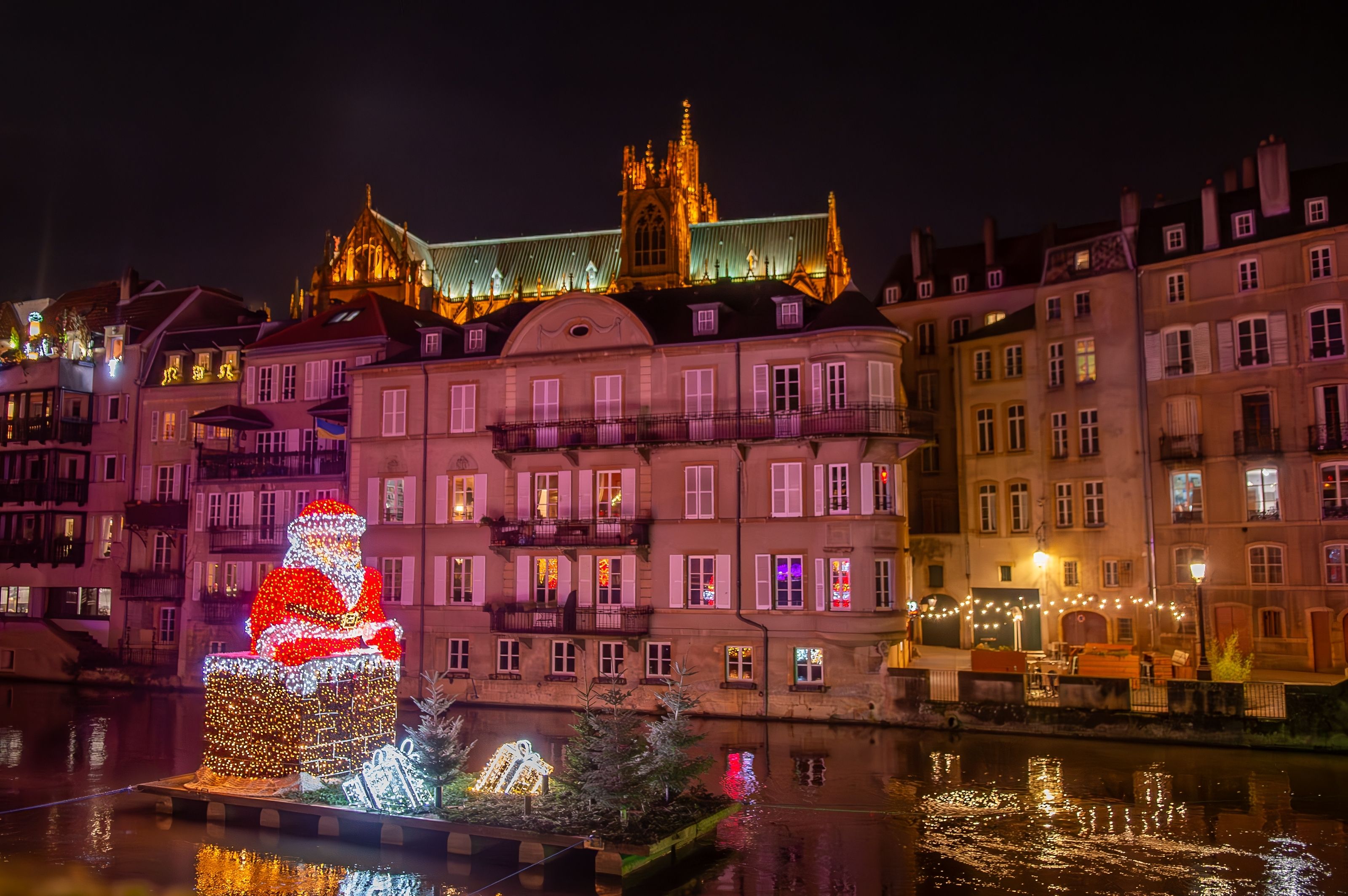 Christmas lights in the city centre of Metz in France with a floating Santa illumination