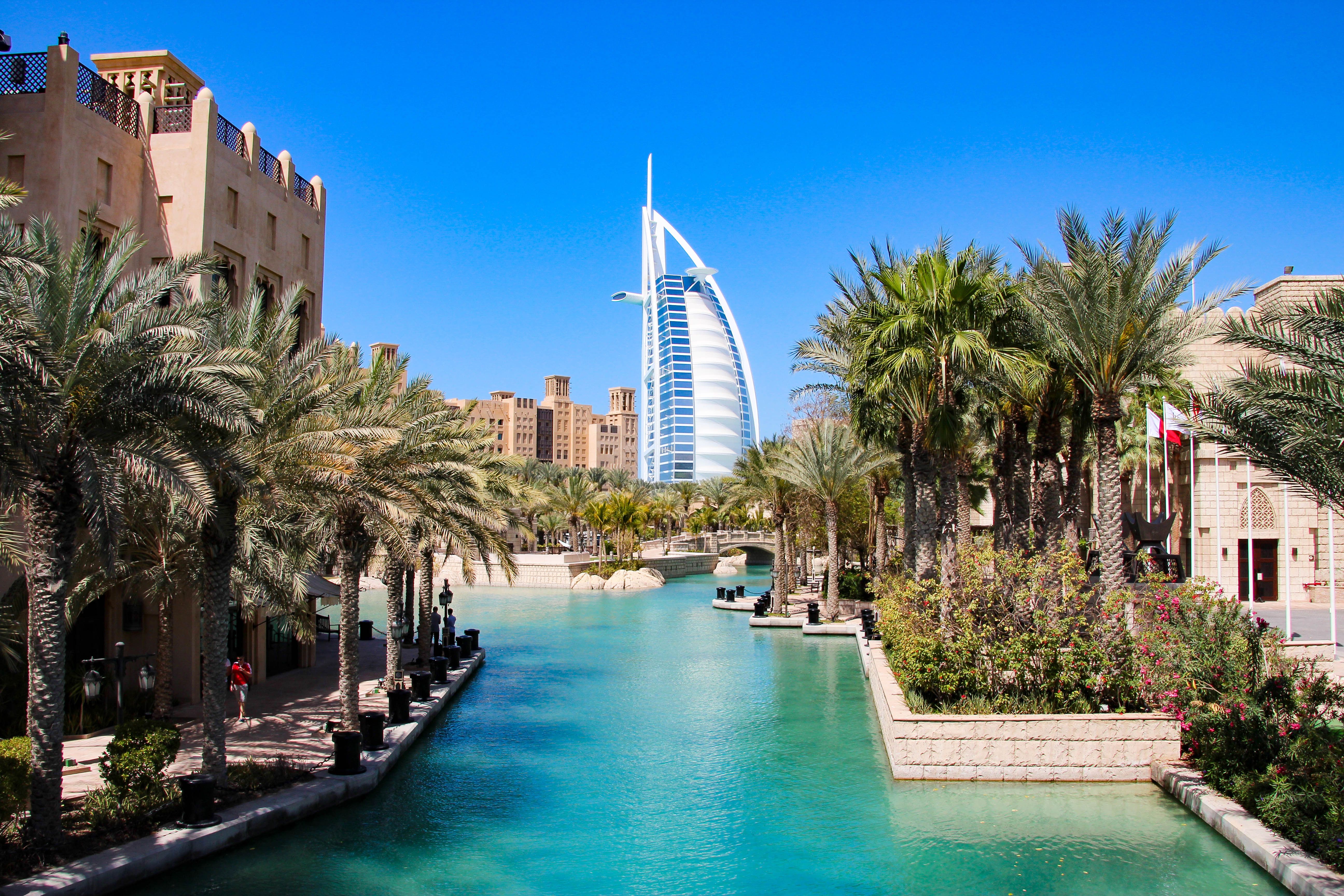 A view of the Burj al Arab in the distance from Madinat Jumeirah in Dubai on a sunny day