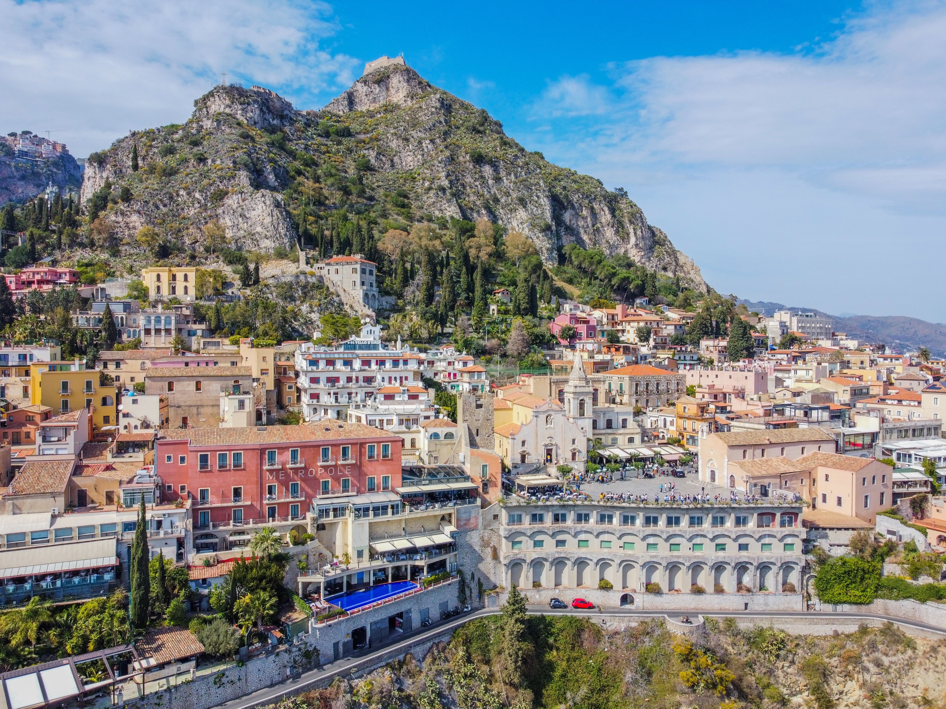 An aerial view of the clifftop town of Taormina in Sicily