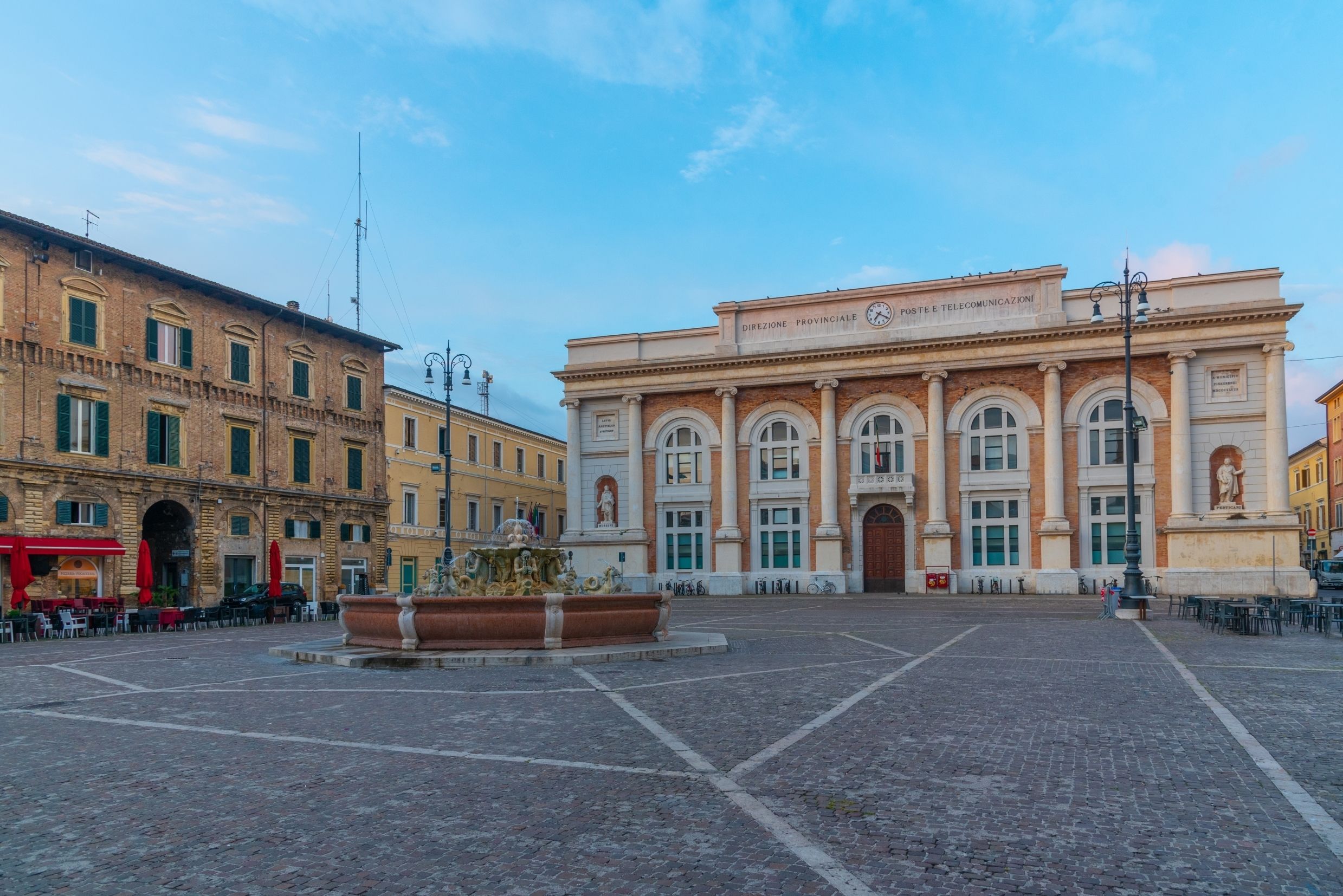 View of Piazza del Popolo (the central square) in Pesaro with Post Office and Neptune fountain