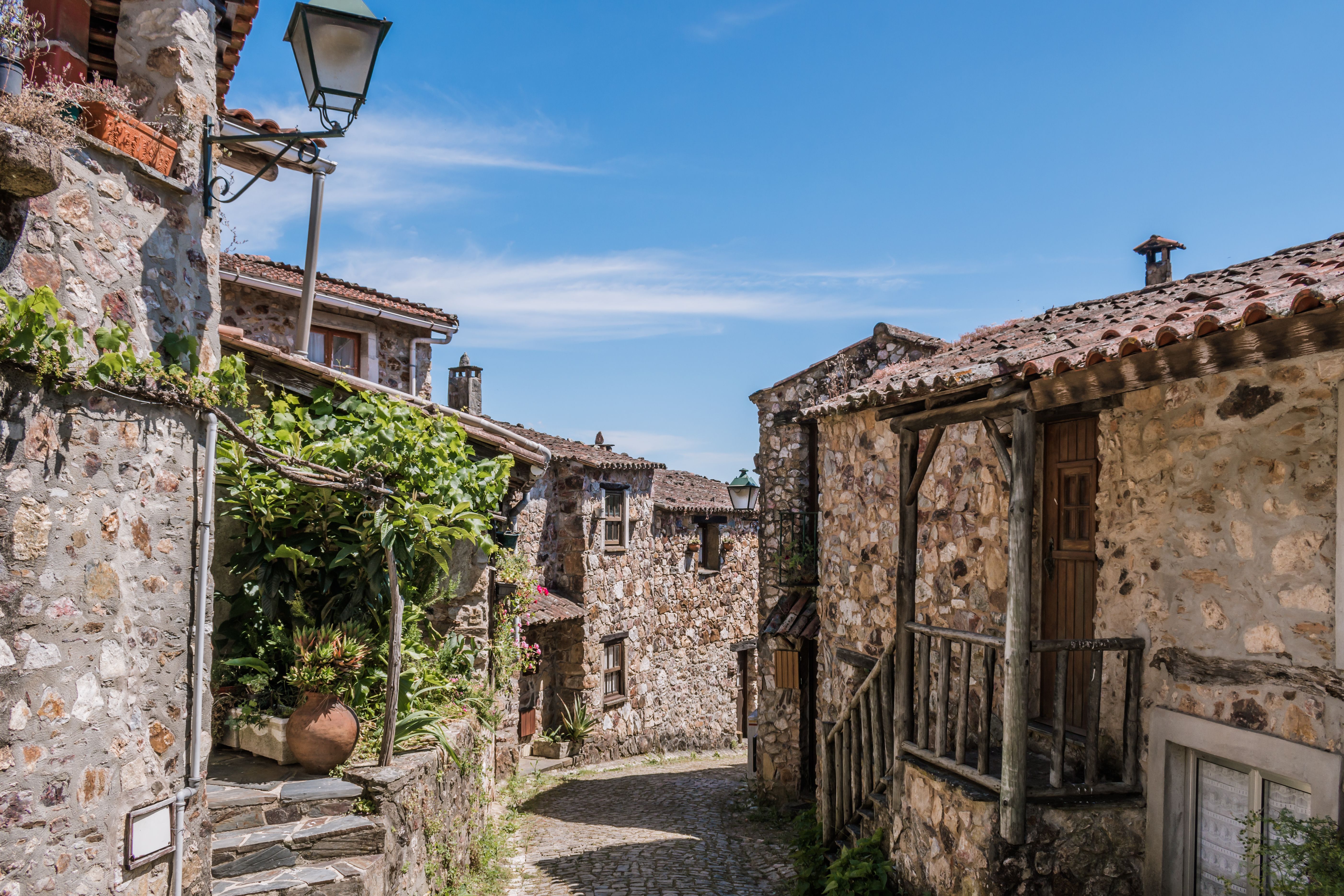 Famous schist village of Casal de São Simão, typical stone houses along a narrow street in Portugal