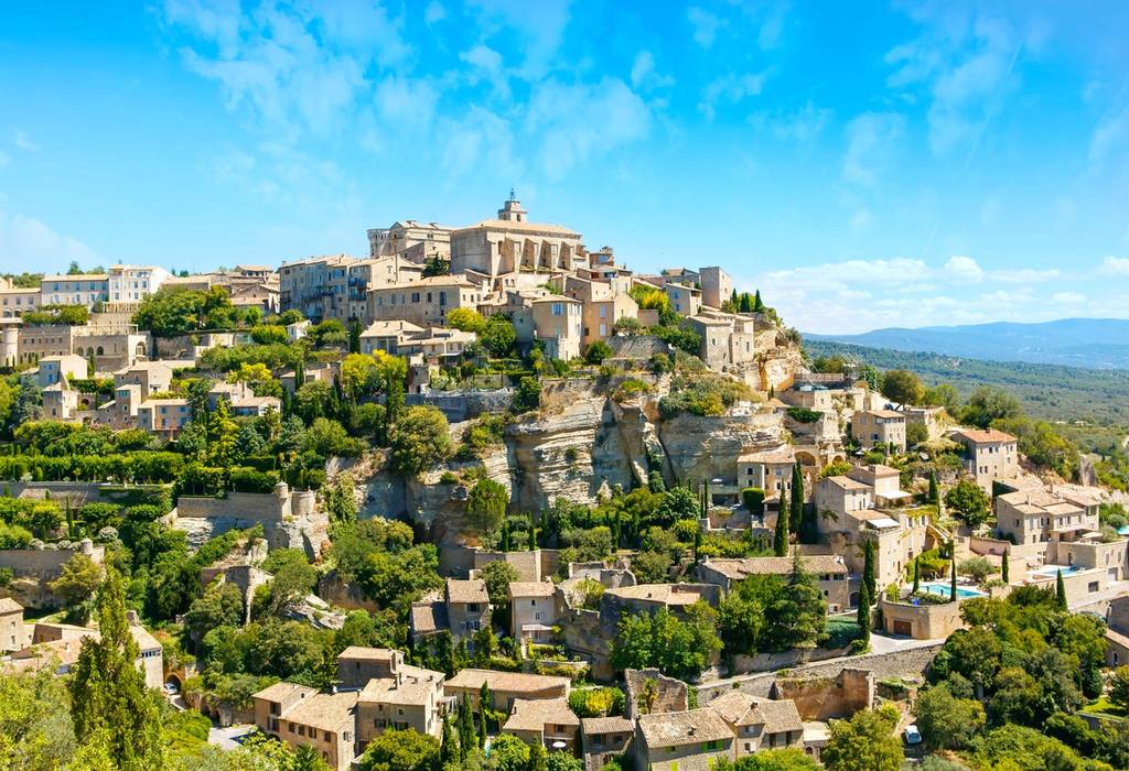The hilltop town of Gordes, crowned by a stone castle and with views over the Luberon Valley