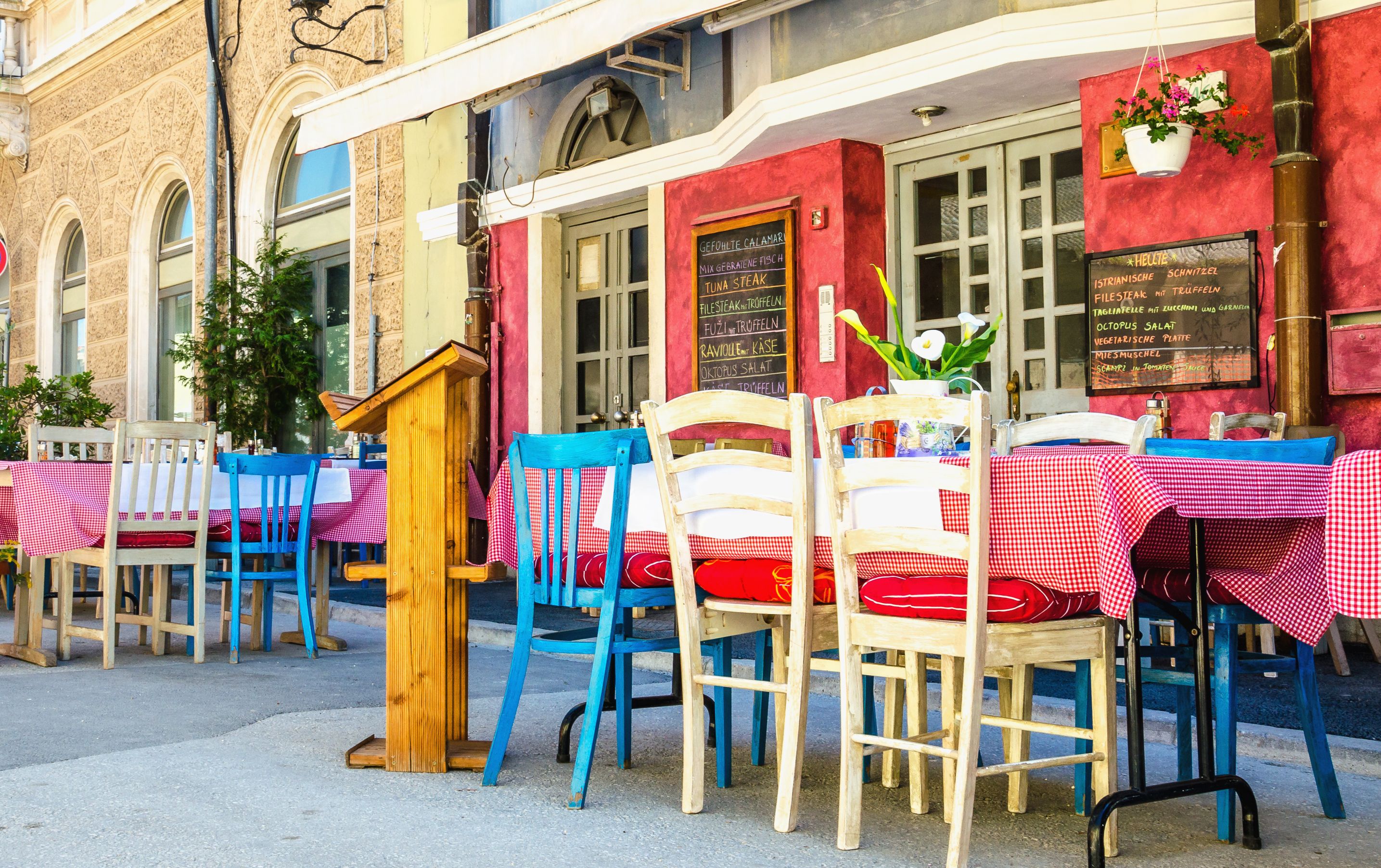 A colourful restaurant with outdoor tables in Croatia